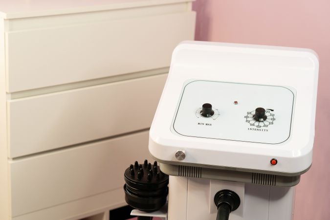 Close-up view of cavitation machine control panel in beauty studio.