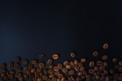 Scattered coffee beans on the side