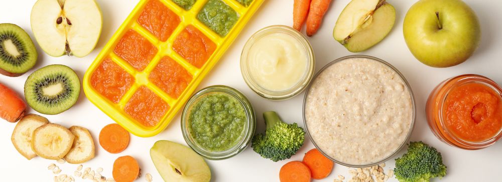 Composition with baby food on plain background, top view