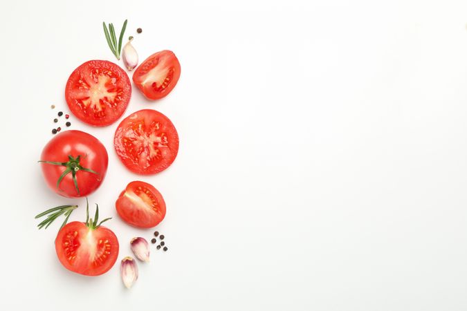 Tomatoes and ingredients on neutral background, top view