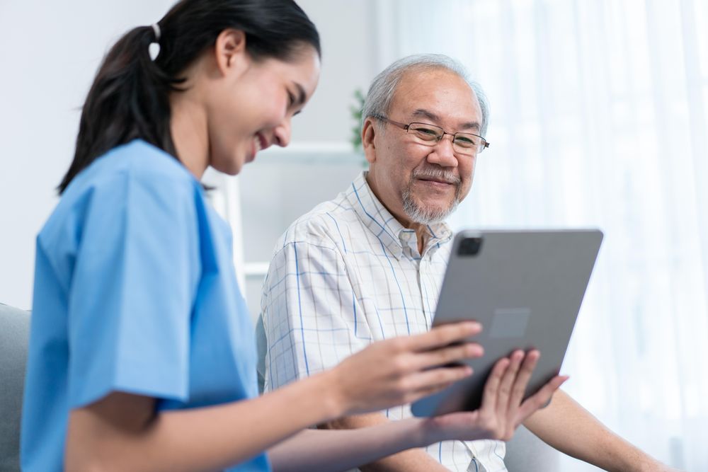 Medical assisted living nurse visiting patient at home