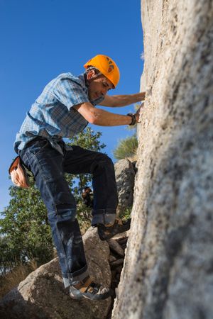 Free climber climbing in nature