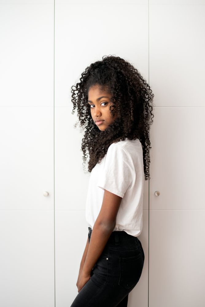 Portrait of a beautiful young Black teenage girl looking into camera
