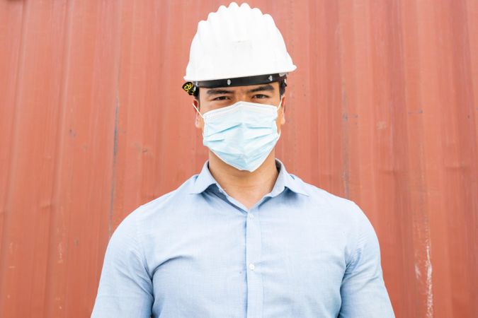 Man in hard hat and face mask