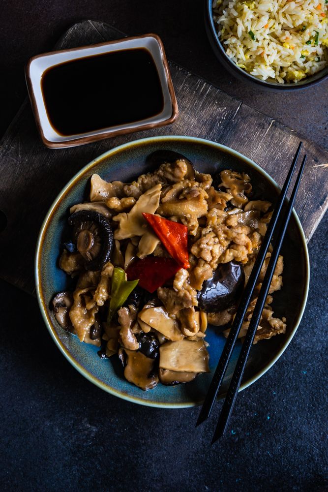 Chinese stir fry served with bowl of egg fried rice