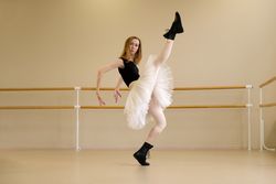 Ballerina in shoes and tutu, high leg kick