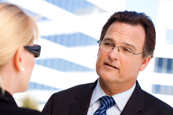 Businessman Talking with Female Colleague