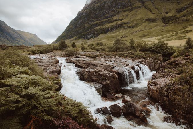 Mountain river with stones on daytime