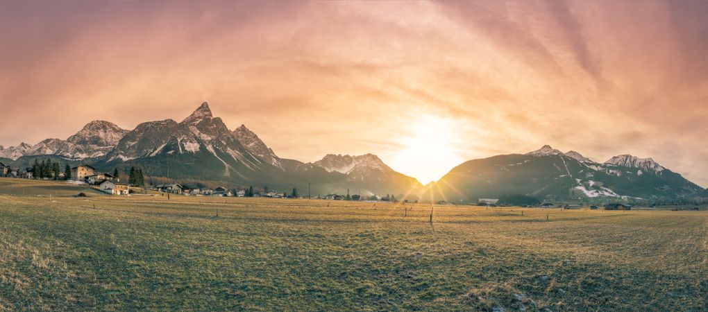 Mountain village and the Alps at dusk