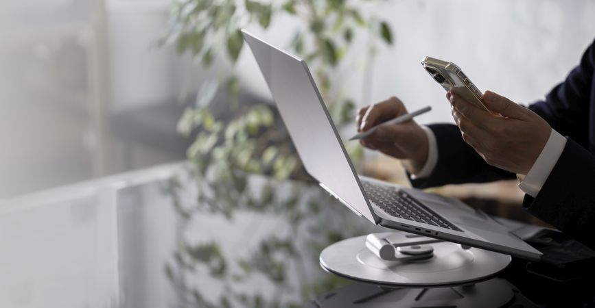 Businessman Working on Laptop at Office Desk
