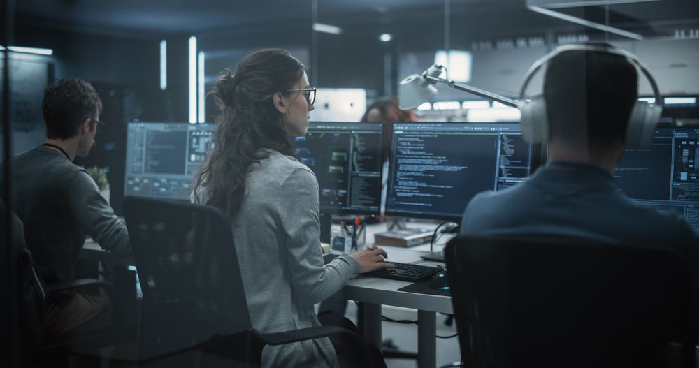 Team of Diverse Multiethnic Software Developers Working on Computers, Programming Advanced Code