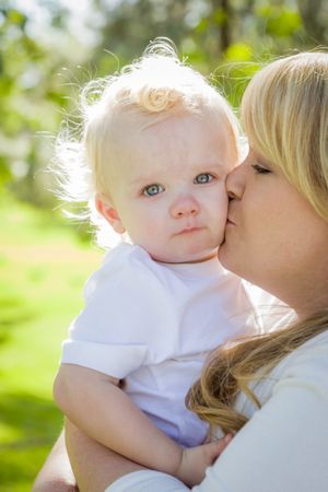 Young Mother Holding Her Adorable Baby Boy