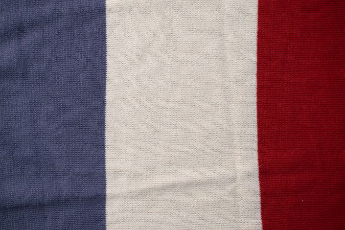 Triple color grey milk and red on knitted fabric background texture.