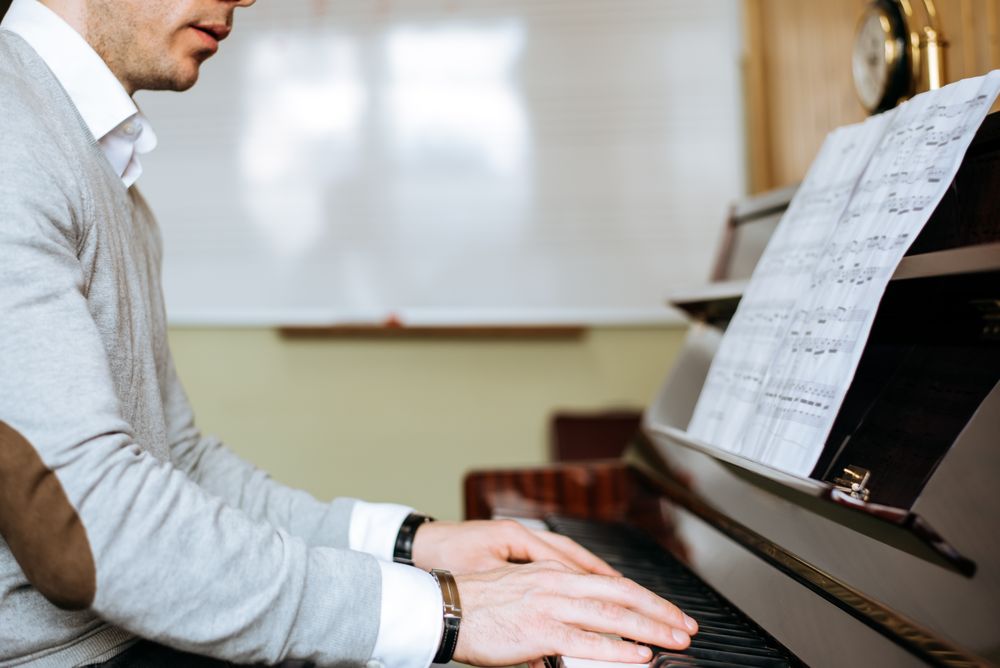 Man playing piano in studio