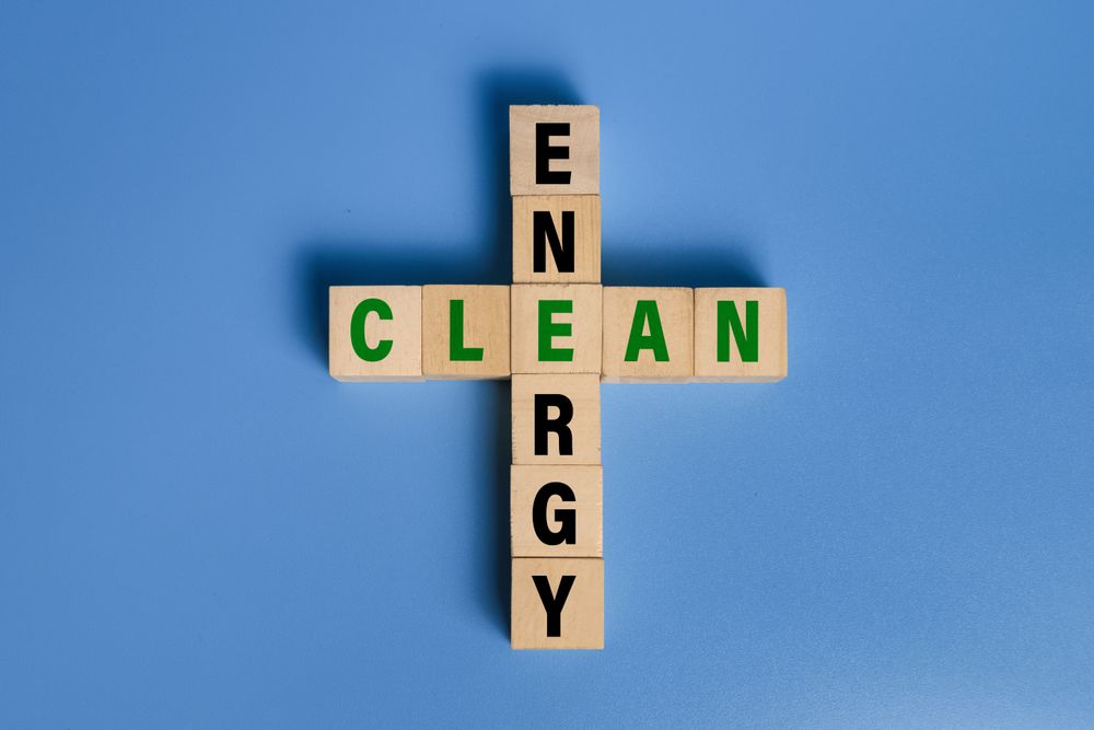 green energy words text on wooden blocks isolated on blue background