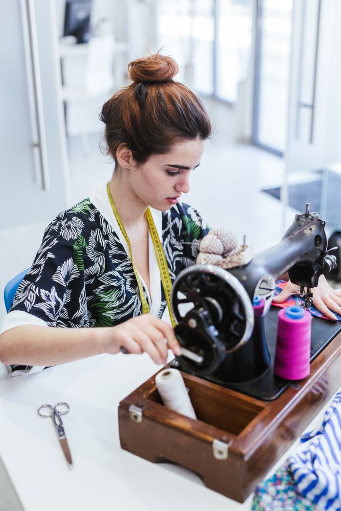 Woman in a sewing school