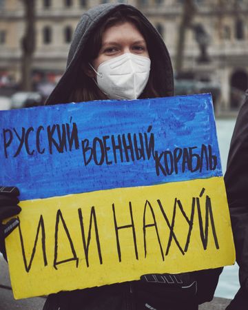 London, England, United Kingdom - March 5 2022: Woman with Ukrainian flag sign