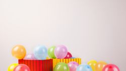 Birthday still life with wrapped presents and balloons