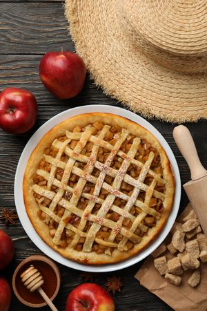 Composition with apple pie and ingredients on wooden background. Homemade food