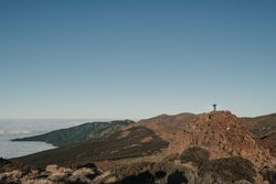Tourist standing on top of hill