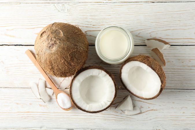 Coconut and milk on wooden background. Tropical fruit