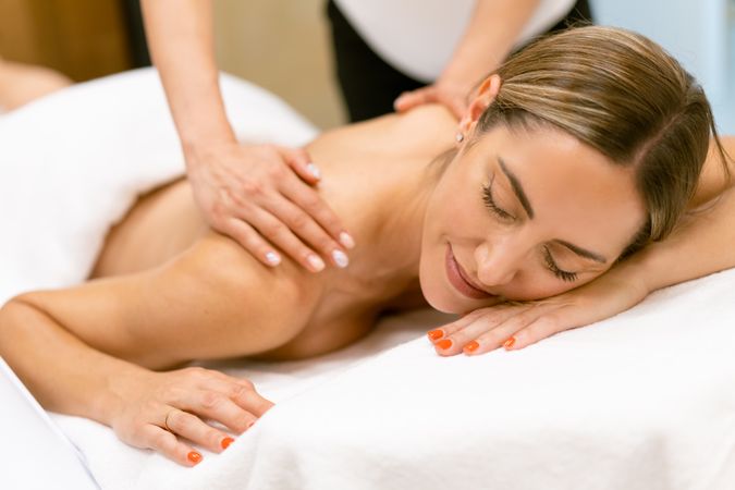 Woman enjoying a relaxing massage at the spa