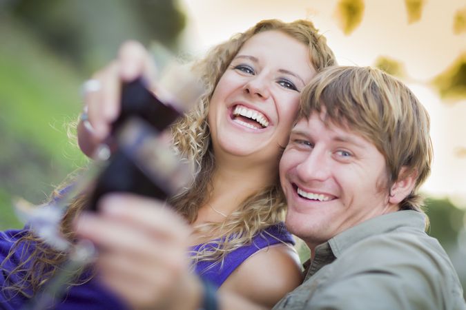 A Couple Enjoying A Glass Of Wine in the Park