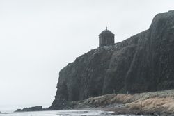 Old temple located on cliff in Northern Ireland coast