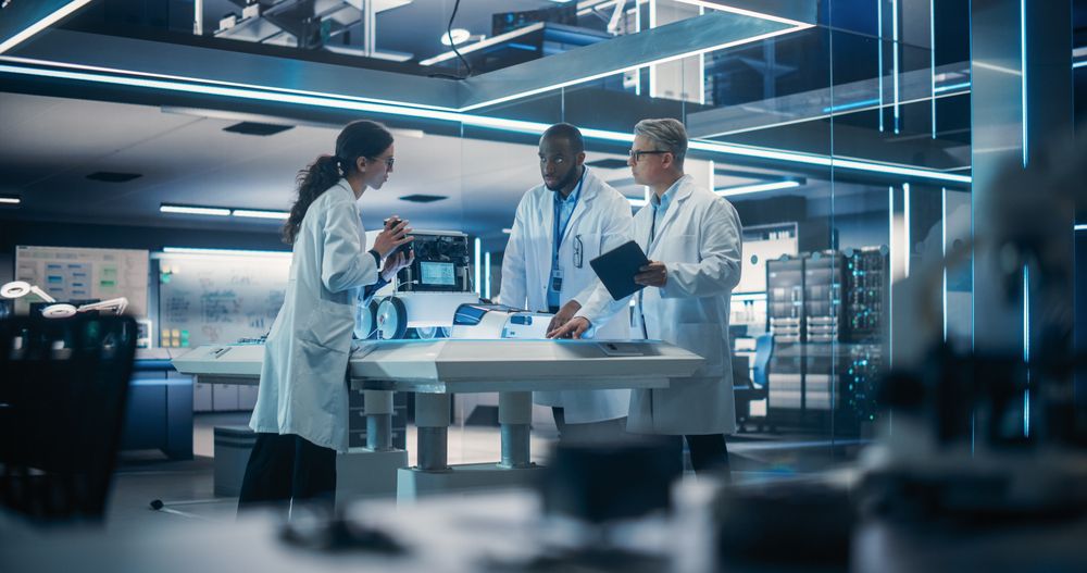 Young Male and Female Engineers Discussing an Autonomous AI Delivery Assistant