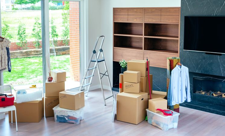 Living room with stack of moving boxes