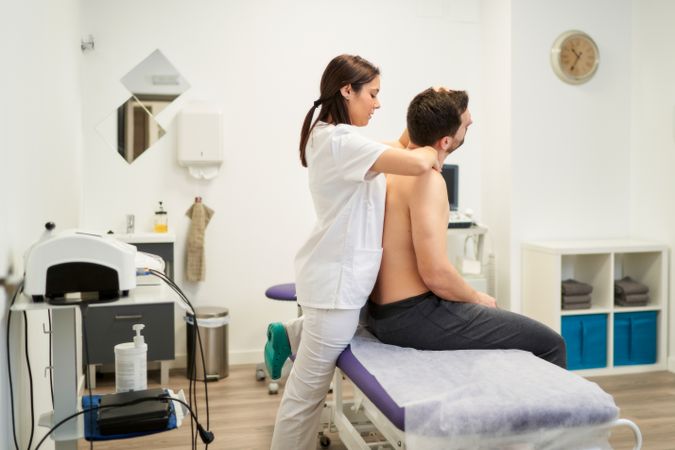 a man being treated for a spinal cord injury at the physiotherap