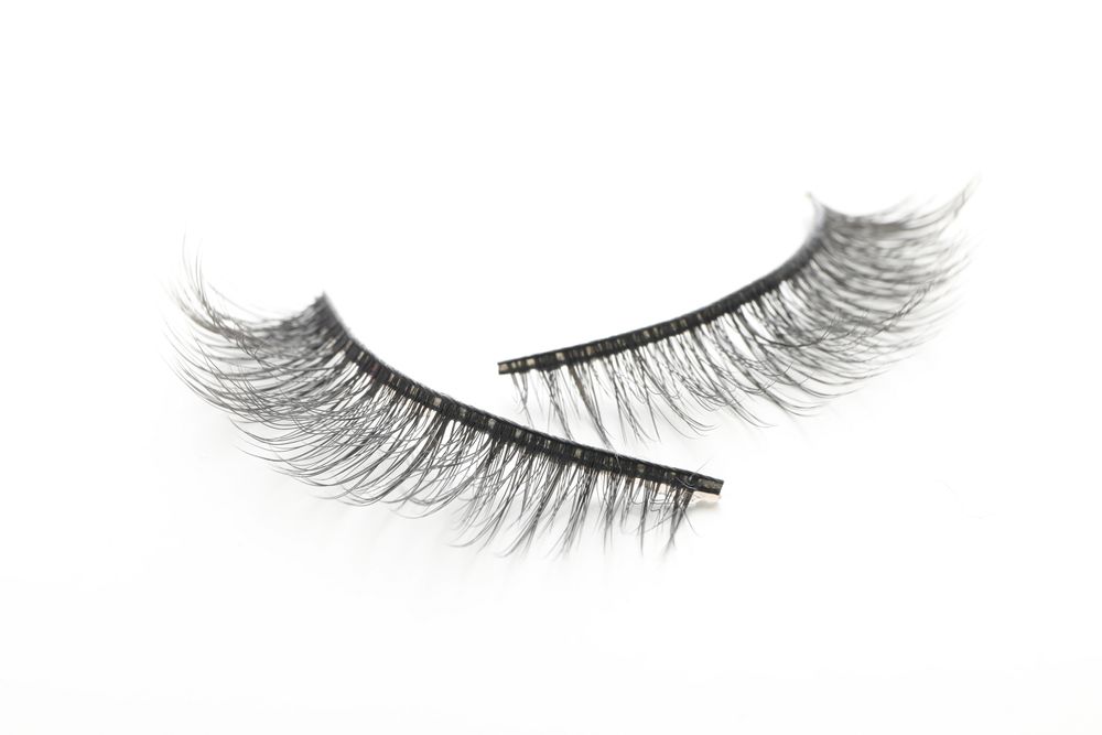 false eyelashes, isolated on light background