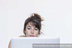 Female sitting at laptop screen, front view bGaAl5