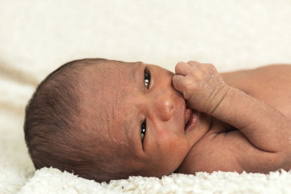 Newborn baby on soft blanket
