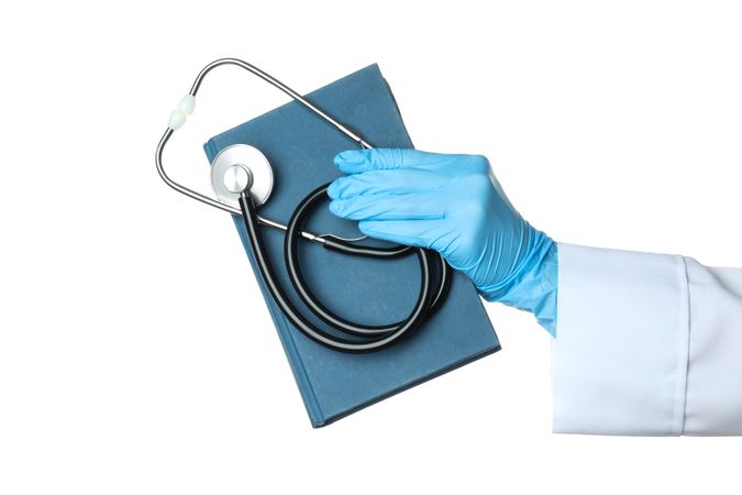 Concept of different professional books - medicine books, isolated on light background