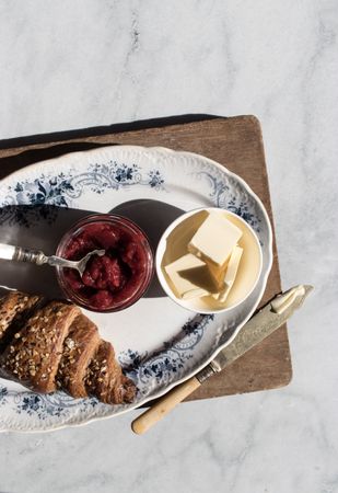 Served breakfast meal with sandwich and jam