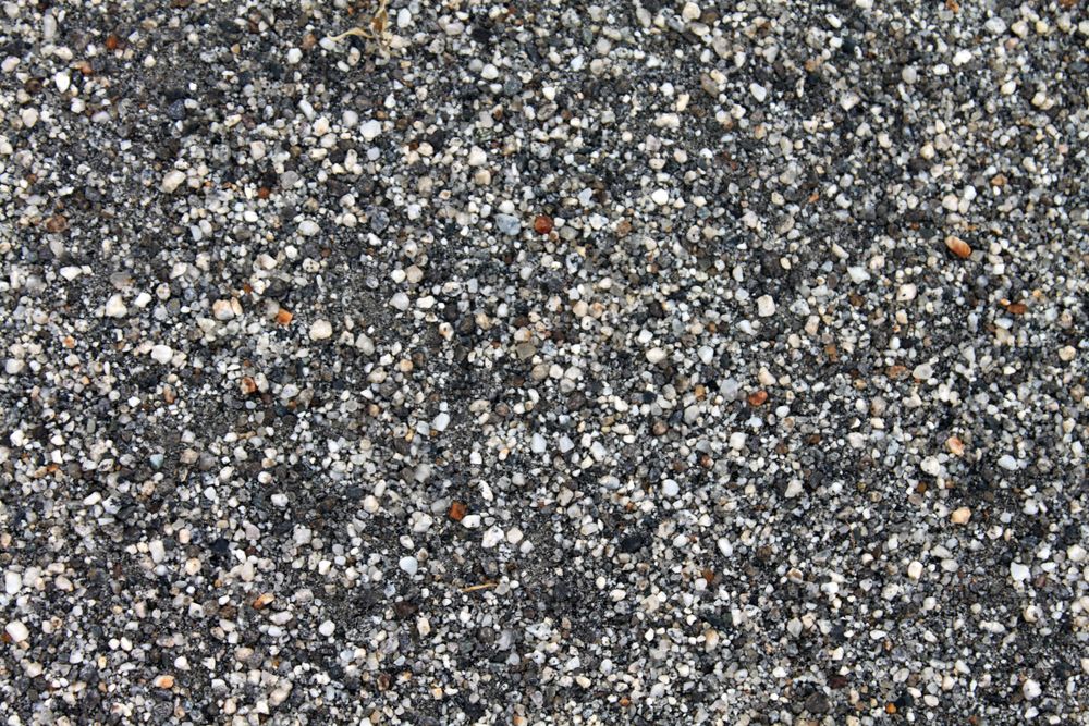 Close up top view of grey pebbles