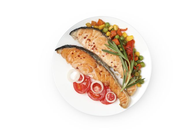 Plate with grilled salmon isolated on blank background