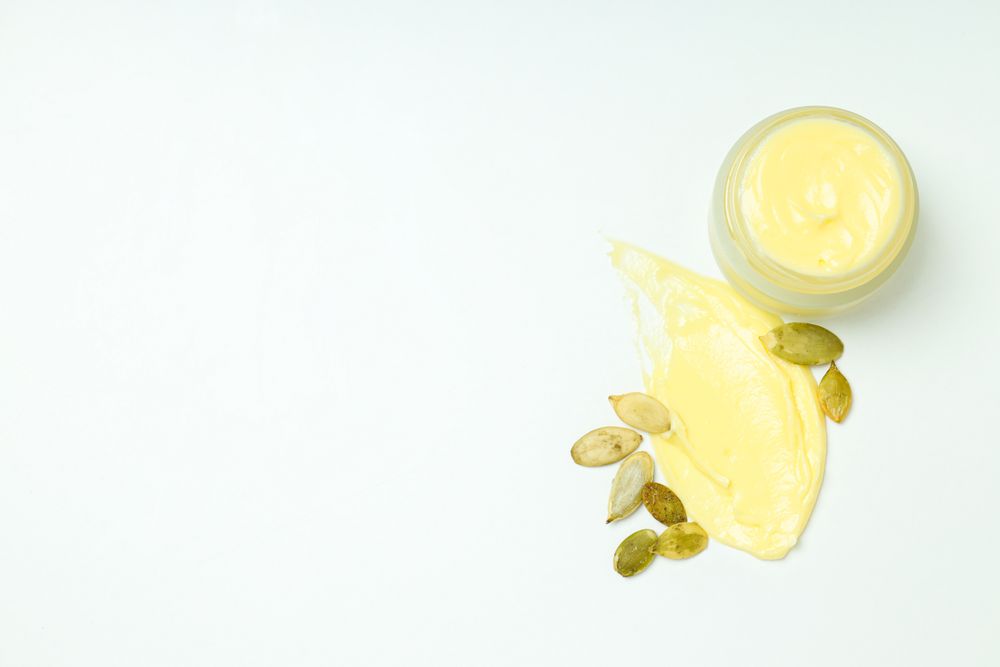 Skin care and face care concept - pumpkin cosmetic