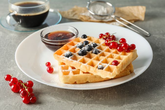 Composition of breakfast with belgian waffles, space for text