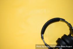 Headphones in corner of yellow background 5oDqAQ