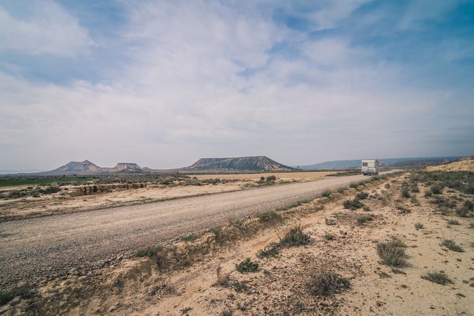 trailer on empty road along desert