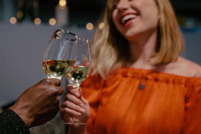 Man and woman toasting on date night