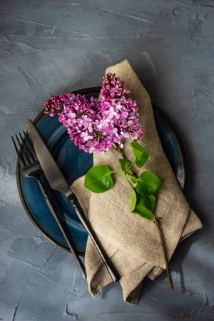 Table setting for spring with lilac flowers