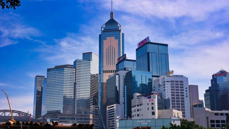 Hong Kong cityscape under blue sky