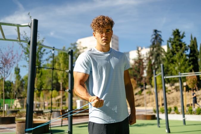 Strong young sportsman doing calisthenics