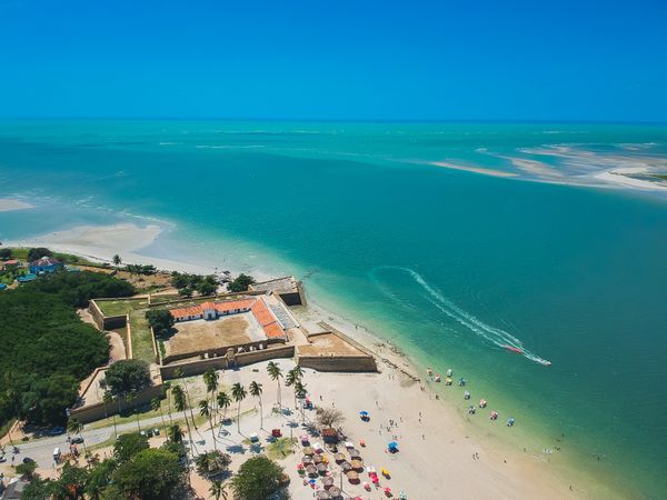 Brazilian beach resort with boat in the water