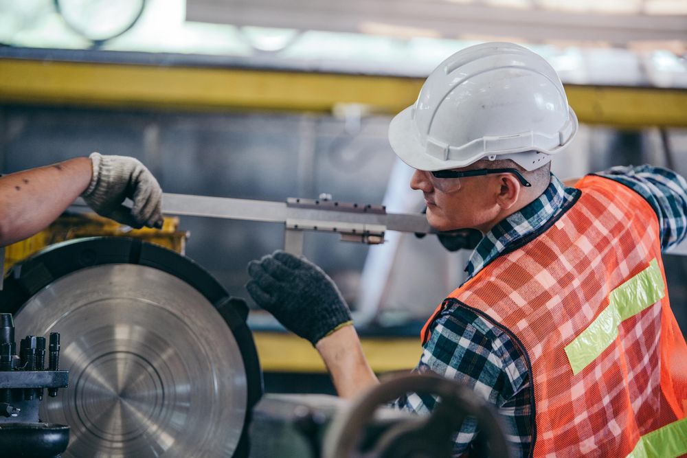 Engineer metalworker industrial experienced operator technician worker in safety hat