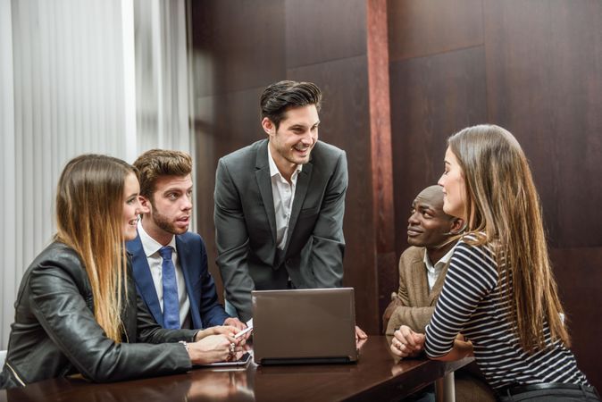 White male leading his colleagues in a brain storming meeting at work