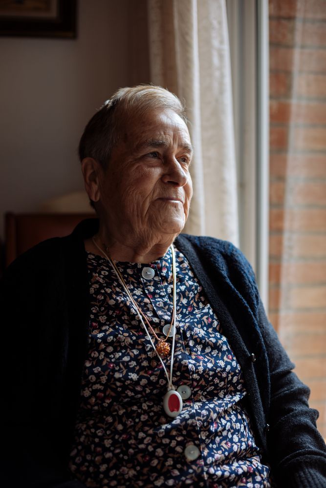 mature woman with personal alarm hanging from the neck